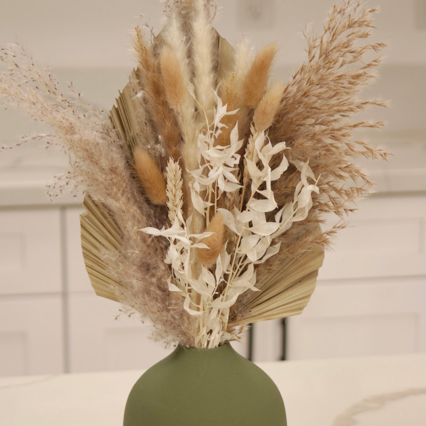 Dried Floral Arrangements in Green Vase