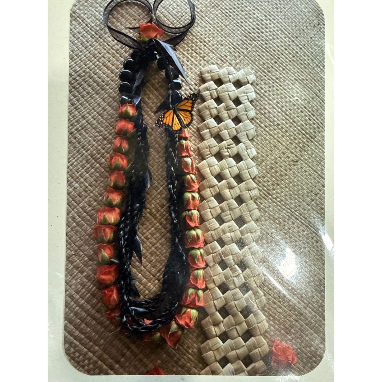 Pulelehua on Rose & Black Ti Leaf Lei